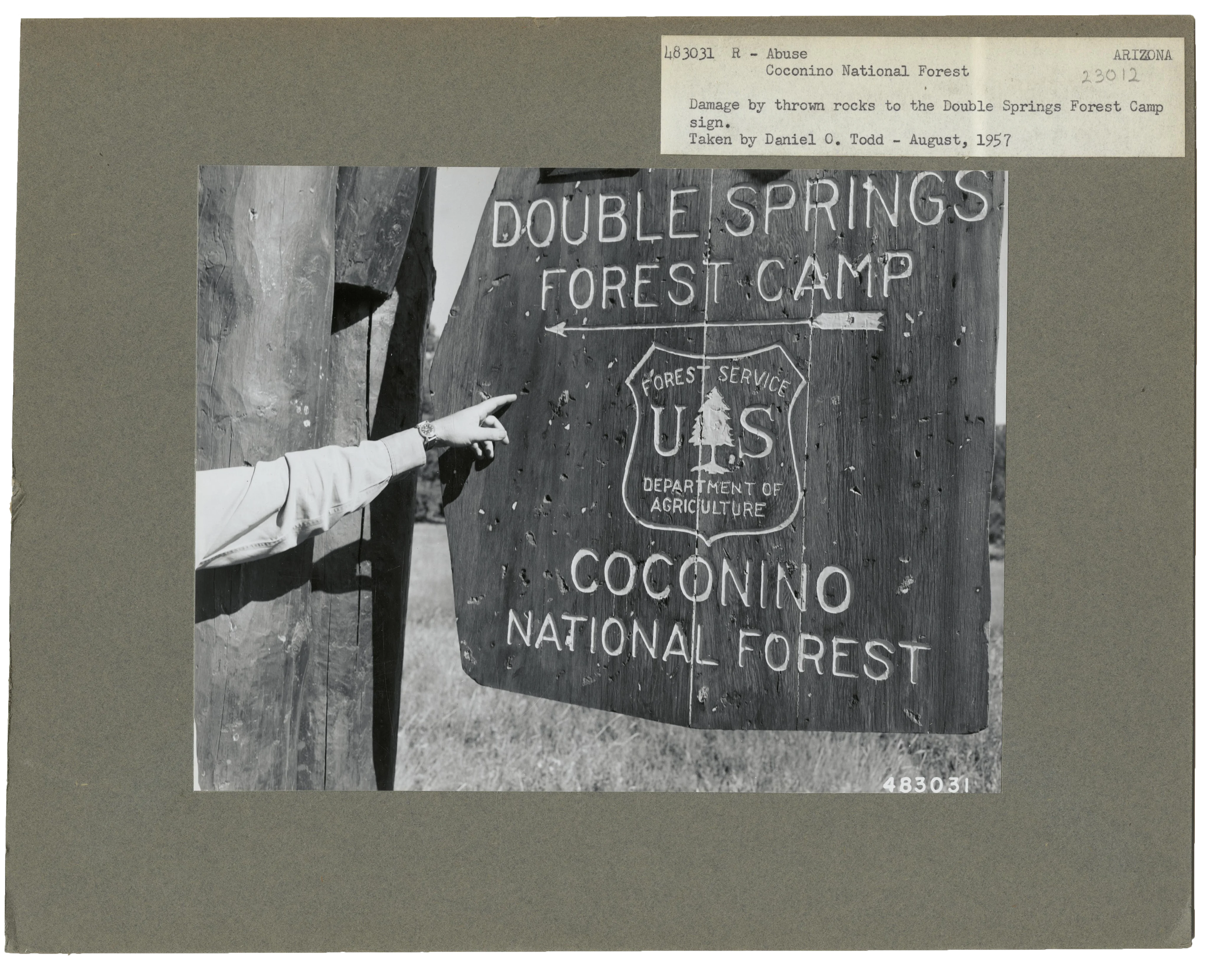Sign damaged by thrown rocks